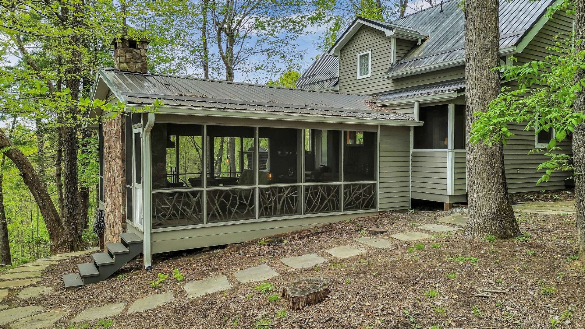 Large screened porch with fireplace.