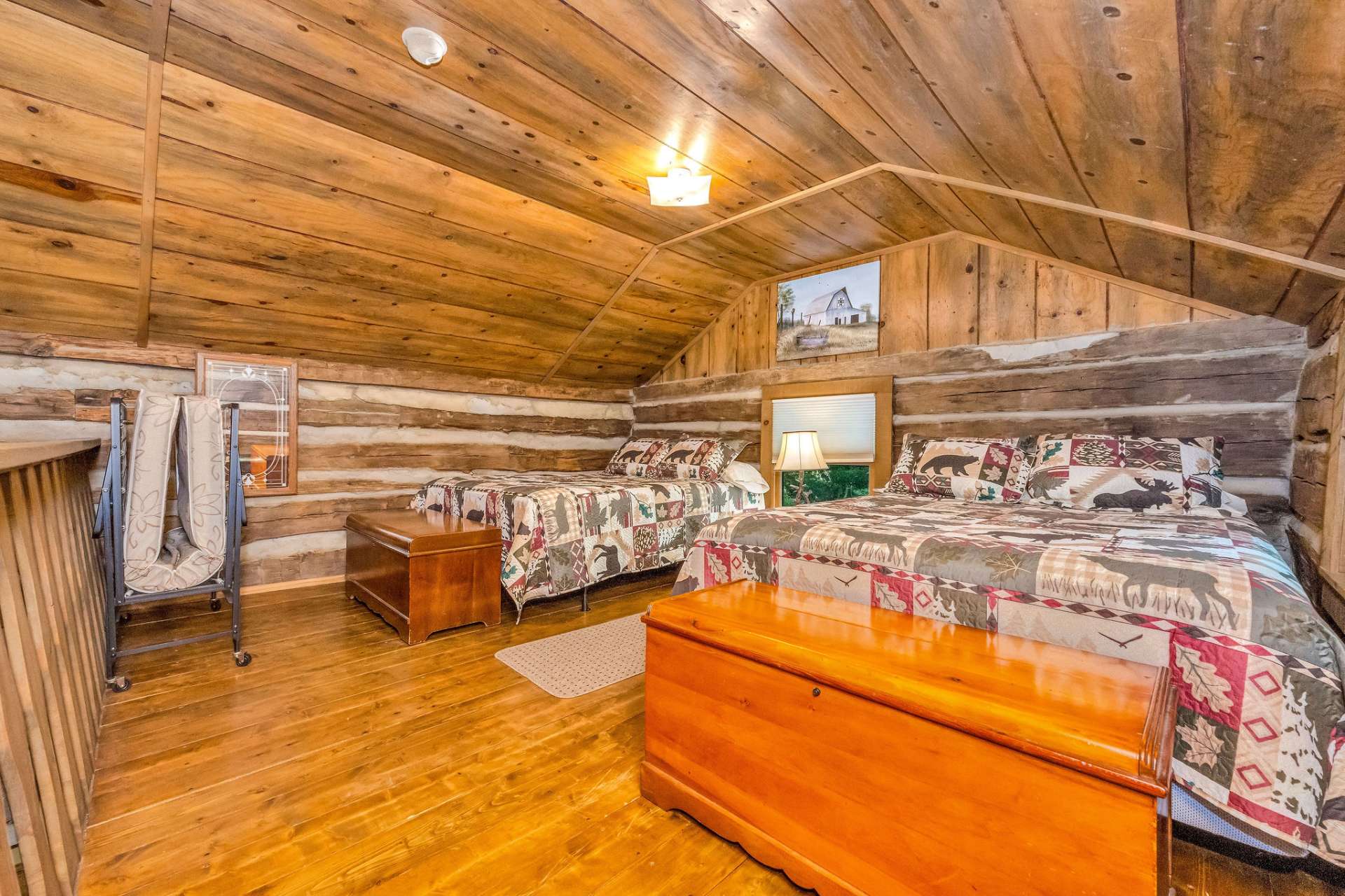 The loft area provides an option for additional sleeping space, a sitting area, or office space.