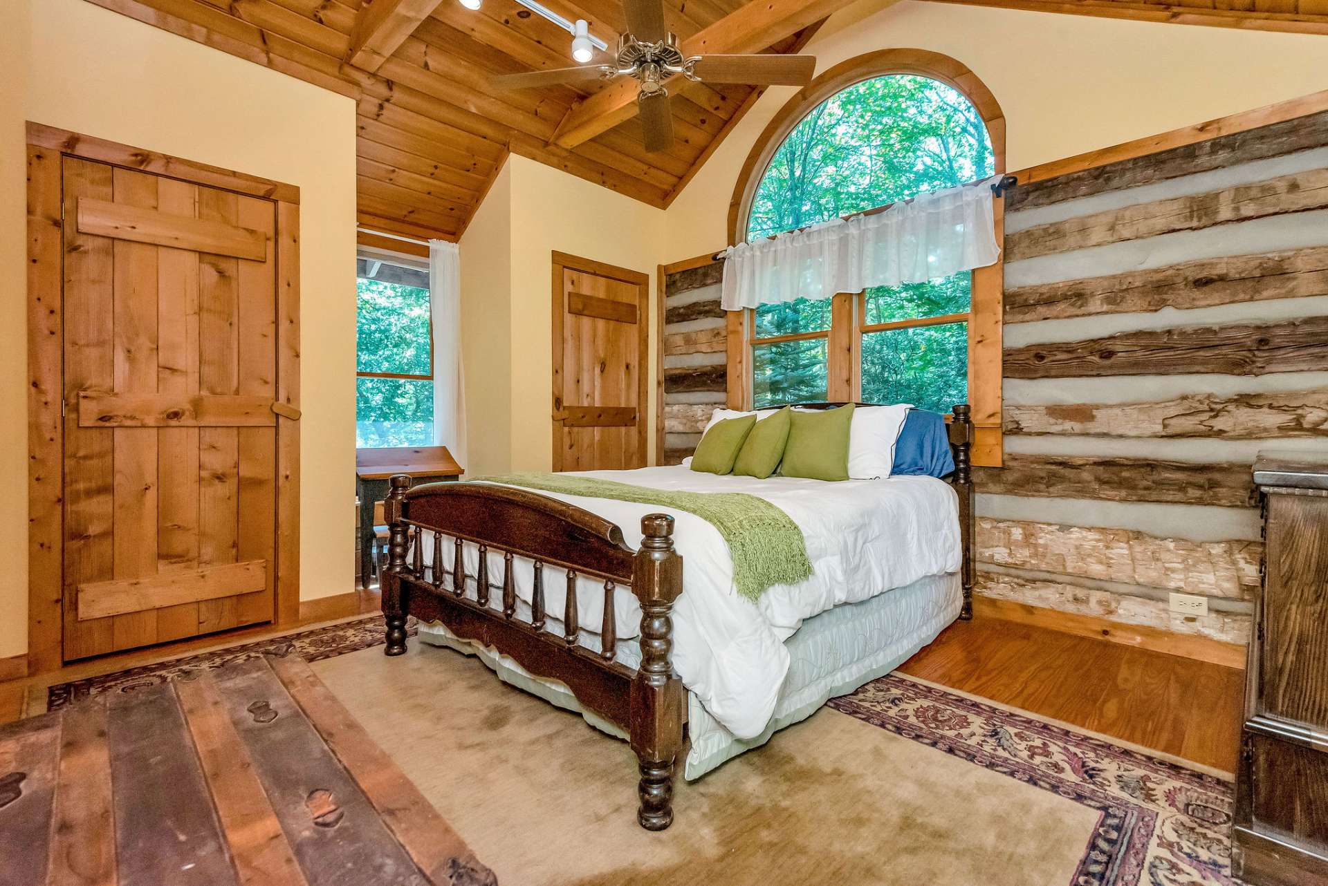 The primary bedroom offers double closets and windows all around, filling the room with natural light.