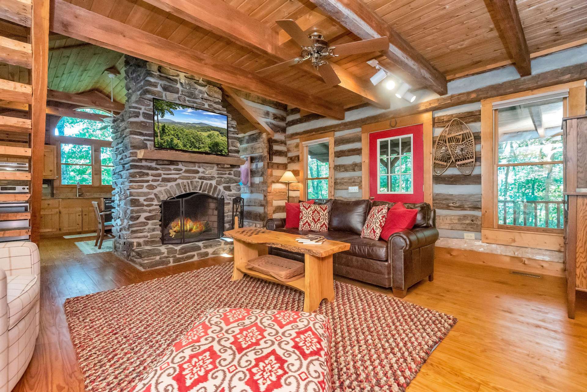 This living space is highlighted by the native stone fireplace.