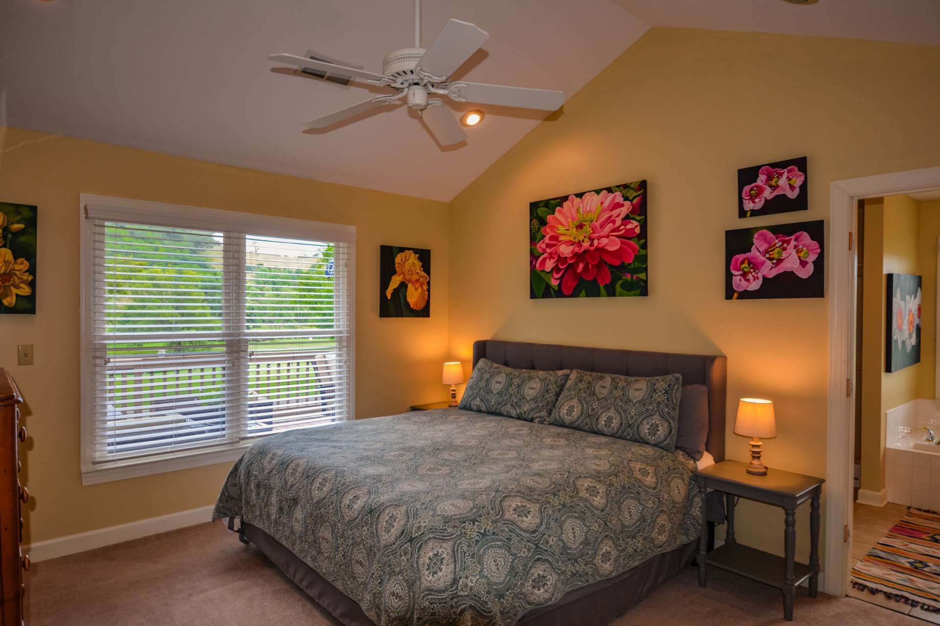 The vaulted master suite is bright and cheery and features a private bath with whirlpool tub, separate shower and walk-in closet.