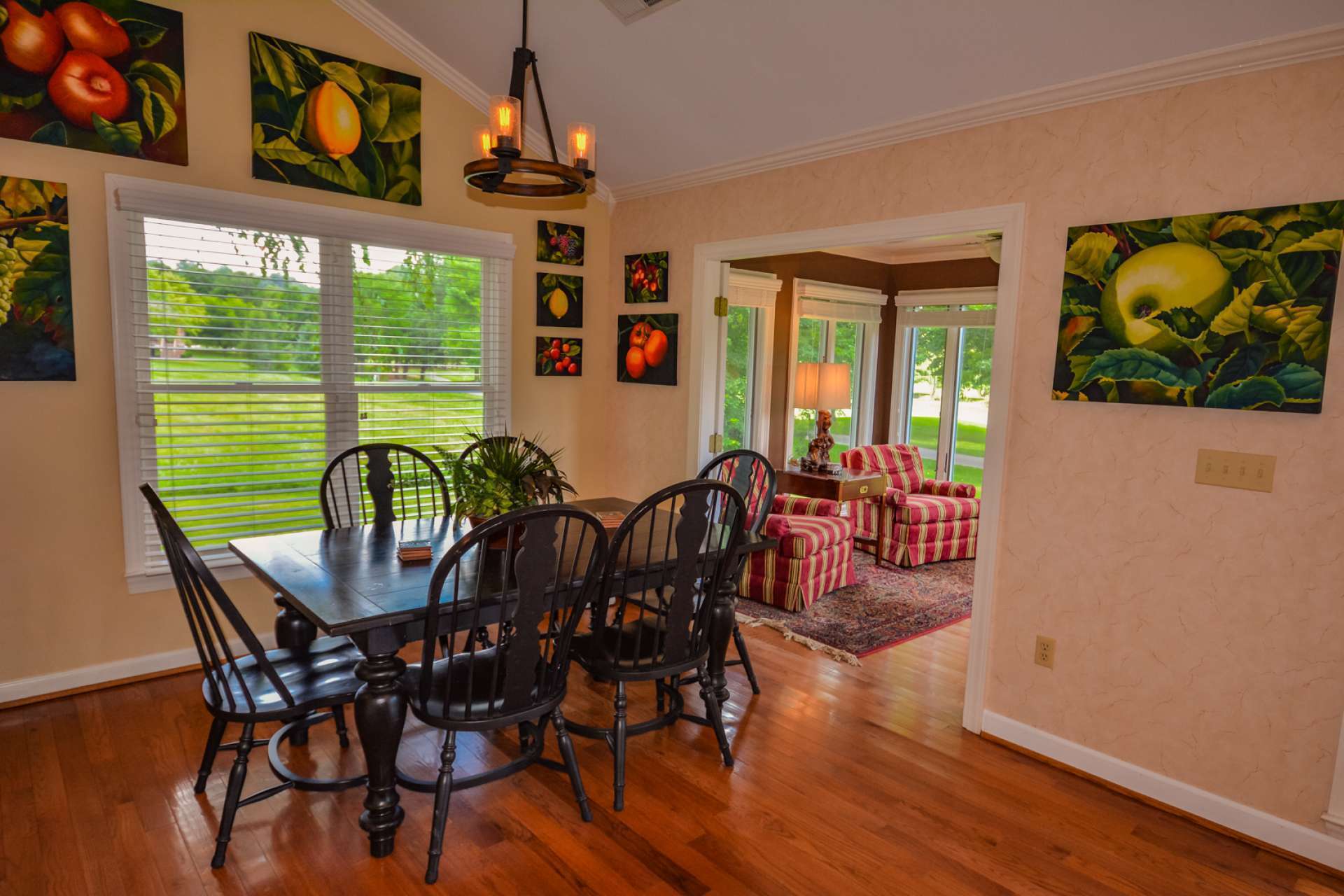 The formal dining area offers a pleasing dining experience and opens to a light filled sun room.