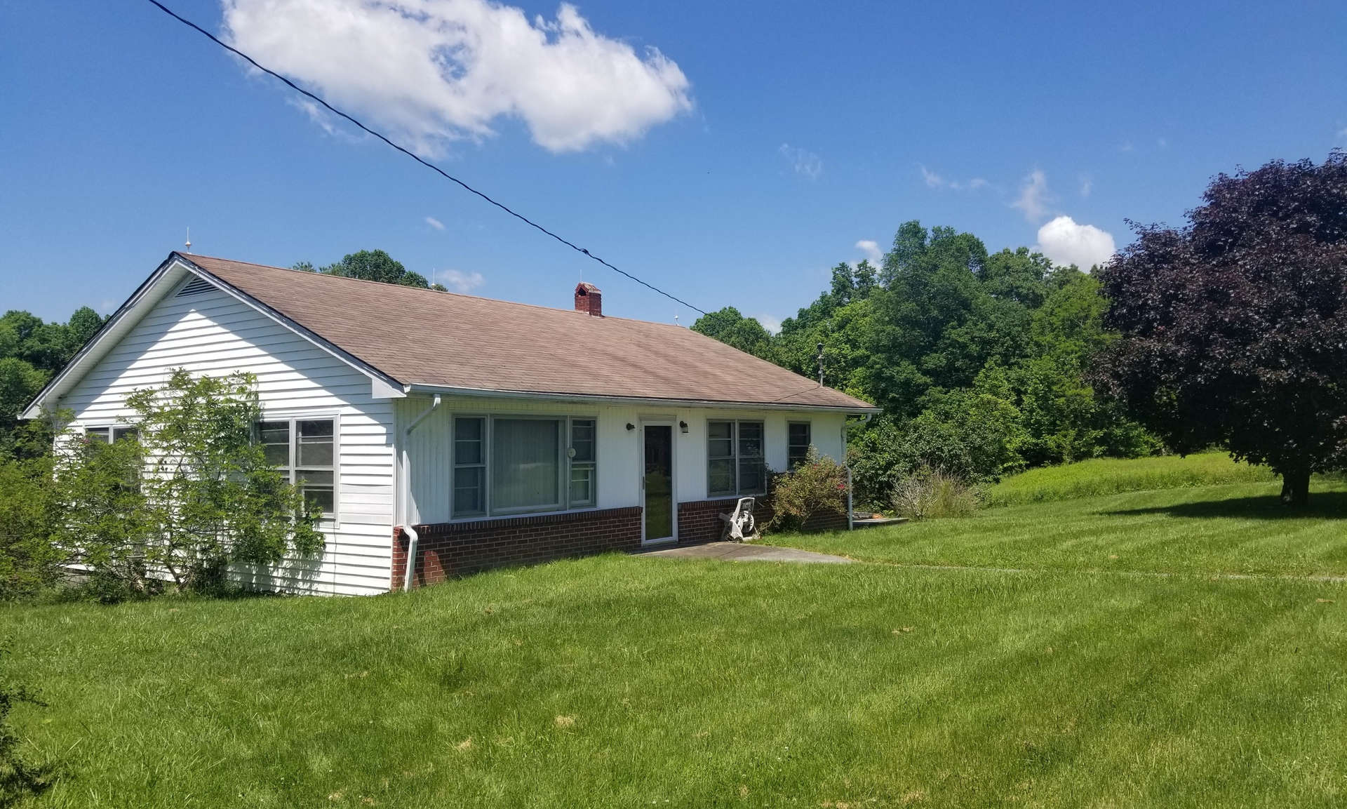 Affordable mini farm for first time home buyers located on 15 acres in the Flatridge area of Grayson County. This classic country cottage offering 3 bedrooms and 1-bath features a level front yard and easy access from a paved state maintained road.