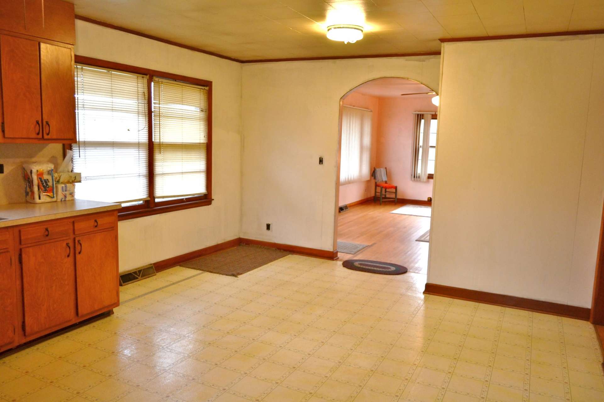 Vinyl flooring in the kitchen/dining area, as well as the bathroom.