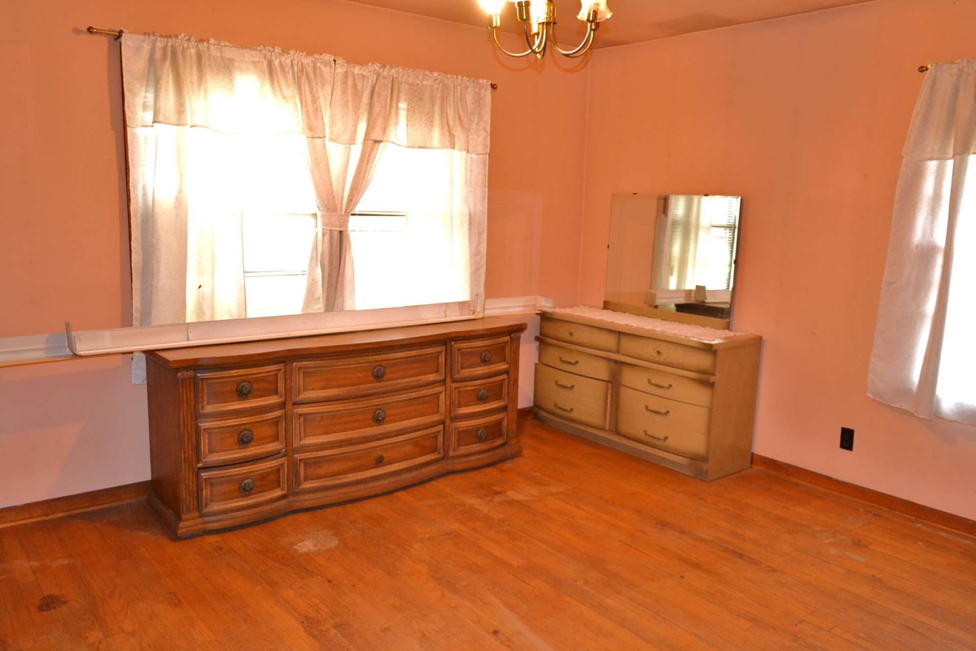 This is the larger of the three bedrooms. The smaller bedroom is the middle bedroom. All of the bedrooms have plenty of windows filling the rooms with light.