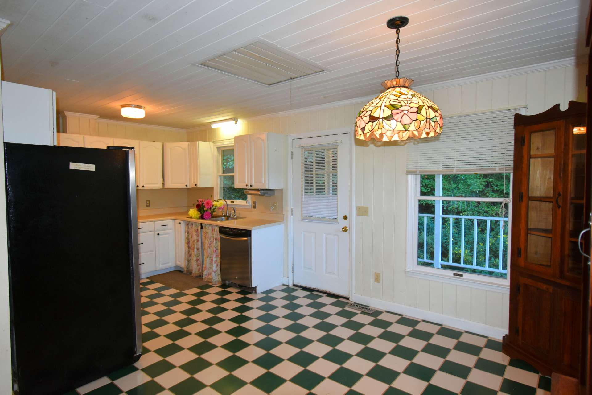 From the kitchen and dining area, you can access the full length covered back porch.