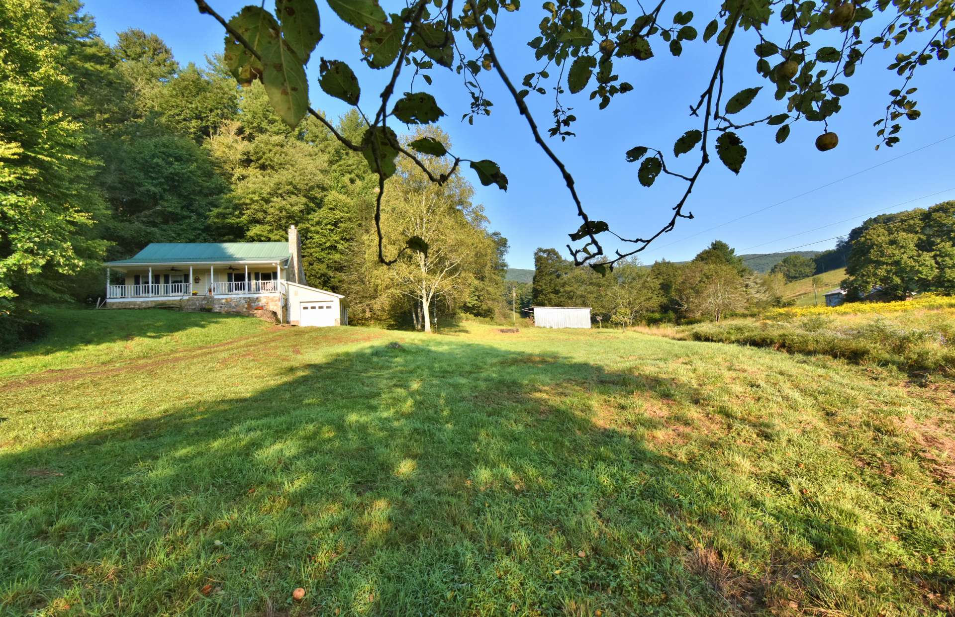 This storybook setting includes 5 acres of open pasture, creek, woodlands, barn, and abundant wildlife.