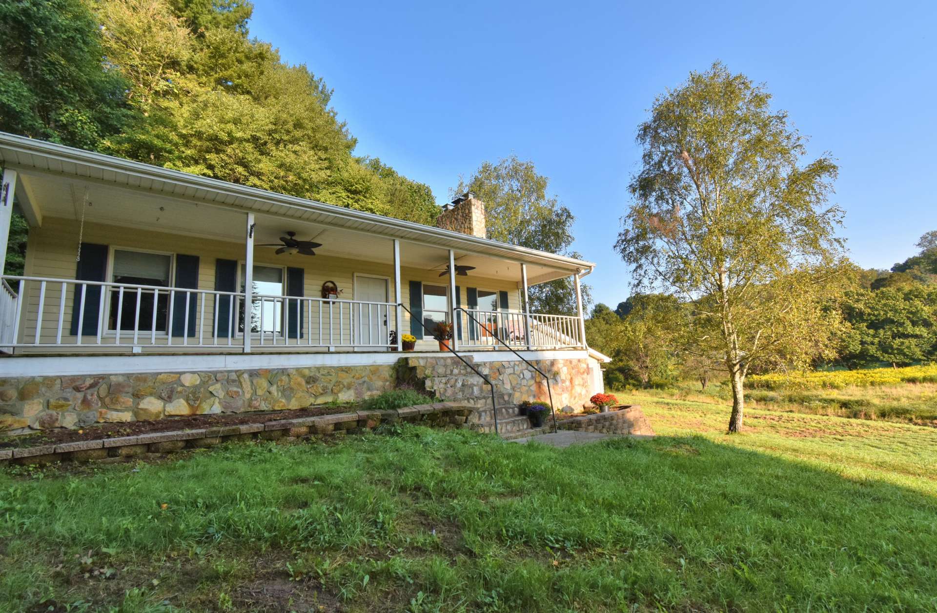 Relax on either the front or back covered porches and enjoy the sounds of the creek, the views, the waterfall, and the surrounding countryside.