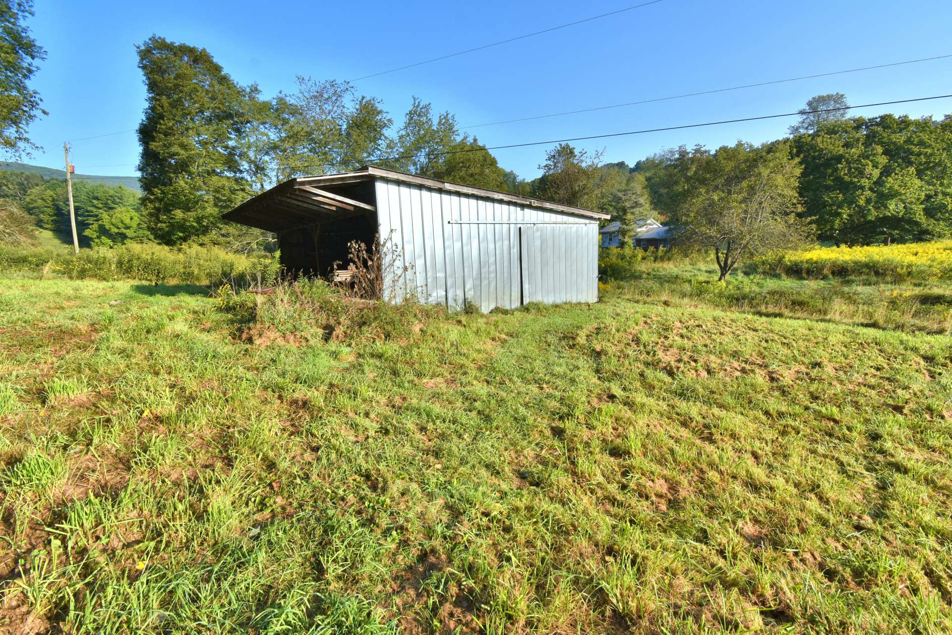 The barn offers an open shed area for equipment storage, as well as an enclosed area with electricity.  This will work nicely for equipment or workshop area.