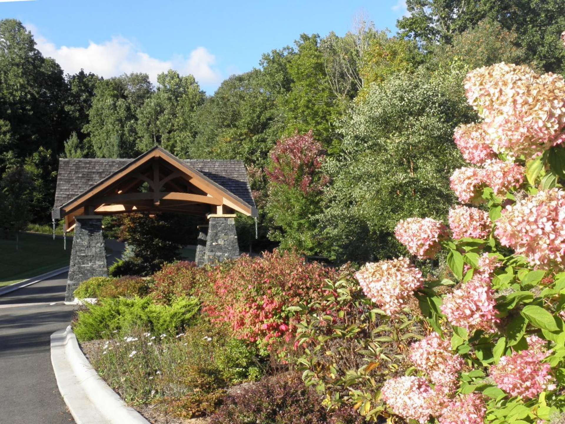 A grand gated entrance with custom detailed structure and water display welcomes residents to their unique mountain home community. Each homesite in Greystone offers access to the common greenways and walking trails. The green space areas include large rock outcroppings and serene wooded areas to explore and enjoy Nature's handiwork.