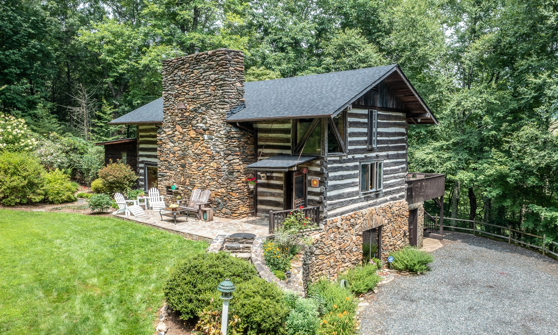 Welcome home! Previously a circa 1848 barn, this magnificent cabin offers privacy and tranquility and a yard with a park-like setting.