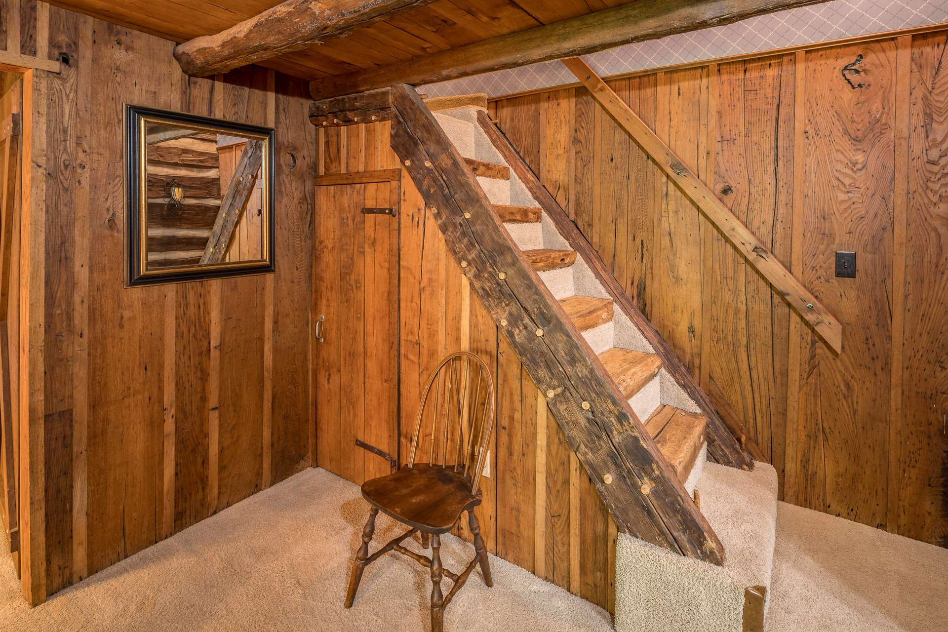 Second set of original hand-hewn stairs leading to the third bedroom - formerly a hayloft of the circa 1848 barn