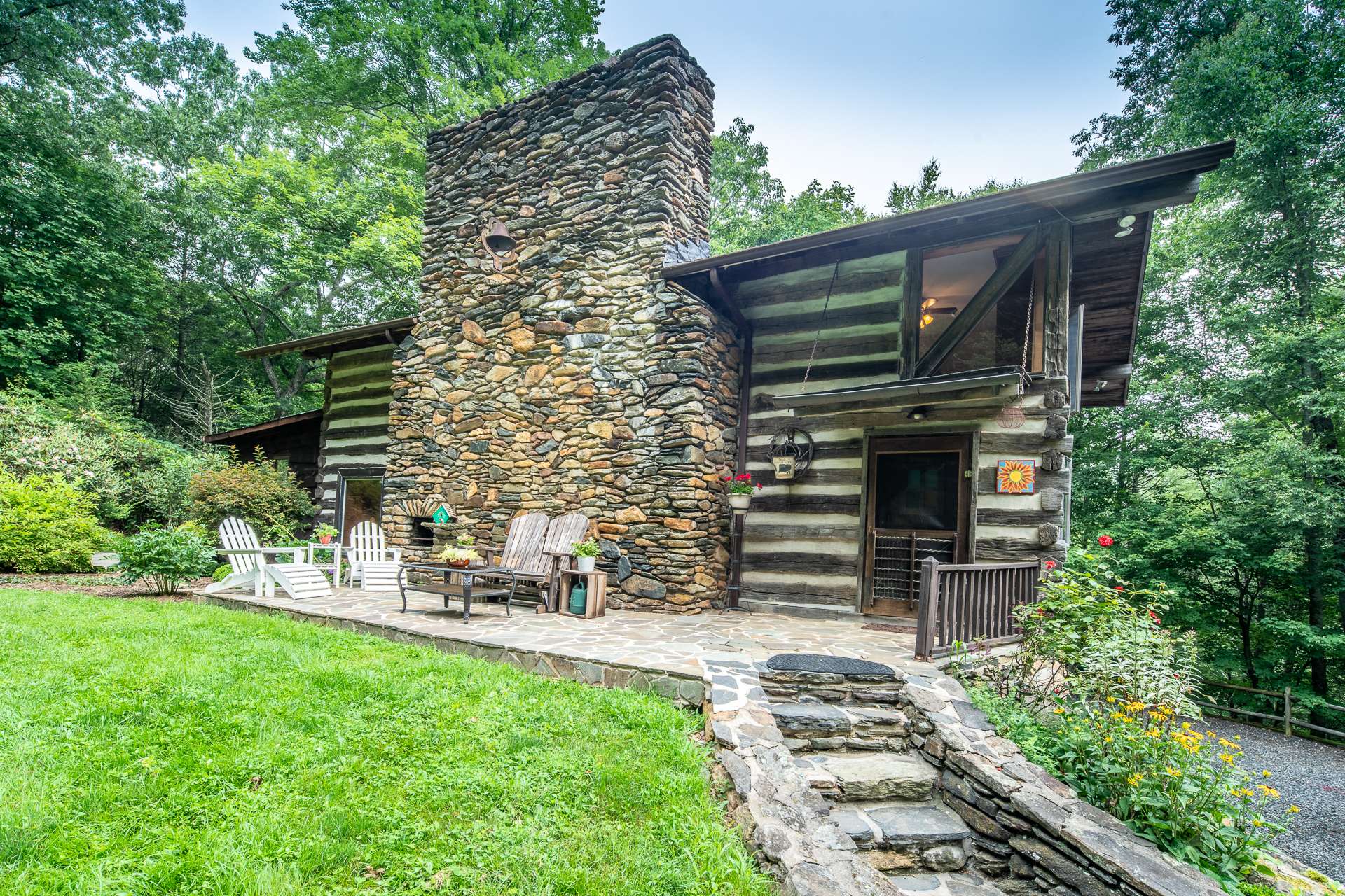 Another view of the stone patio area with front door.