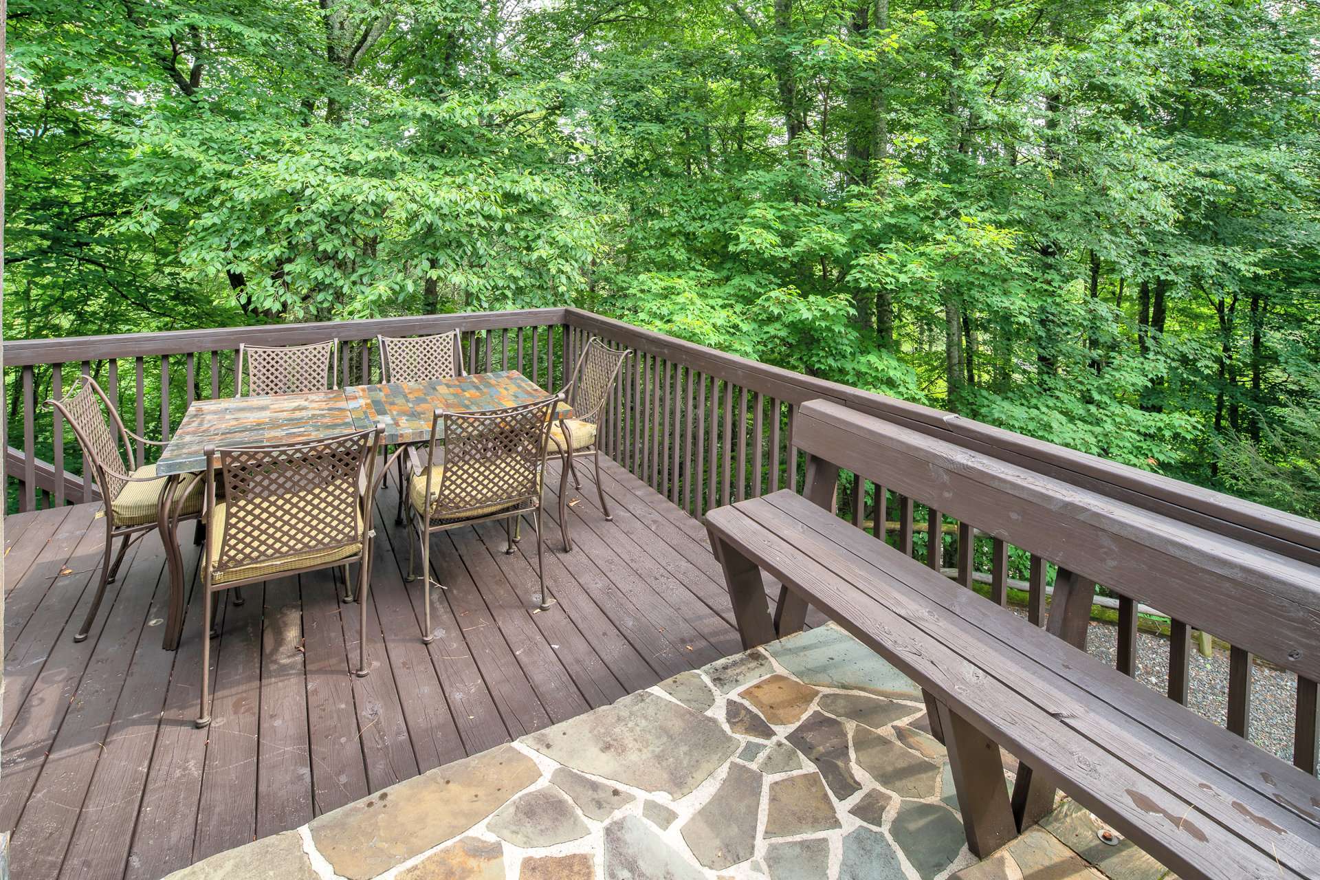 Enjoy outdoor dining and entertaining on the back deck with Nature's bounty all around.