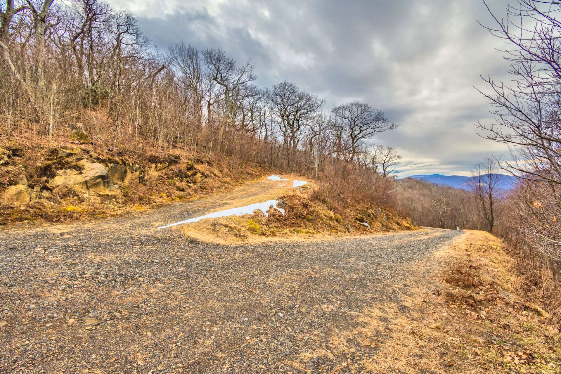 This is the view of the lot from West Pinnacle Drive. This very private homesite backs up to a 52+ acre private mountain estate.