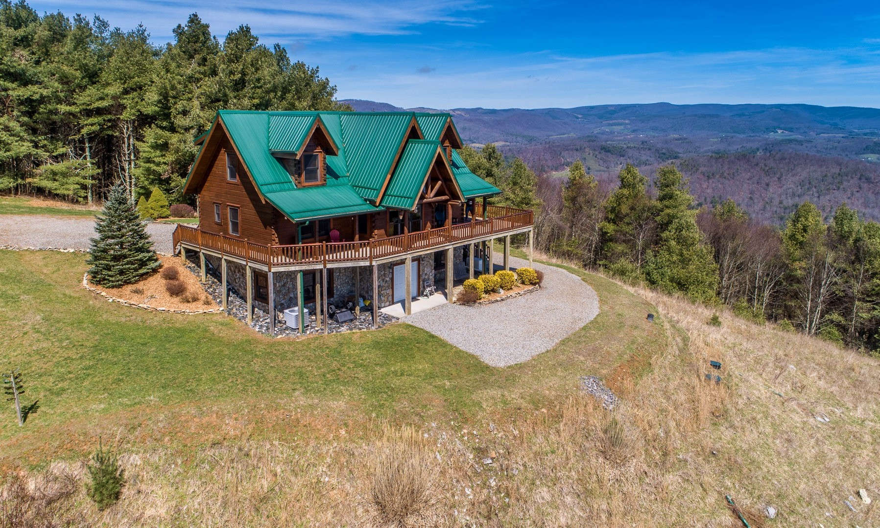 Majestically sited at the end of the road on a rambling 22+ acre setting high on Kindrick Mountain with panoramic long range mountain vista views, this fabulous 3-BR, 3.5-BA Jim Barna log home demonstrates the perfect blend of sophisticated & casual elements as well as quality materials & craftsmanship.