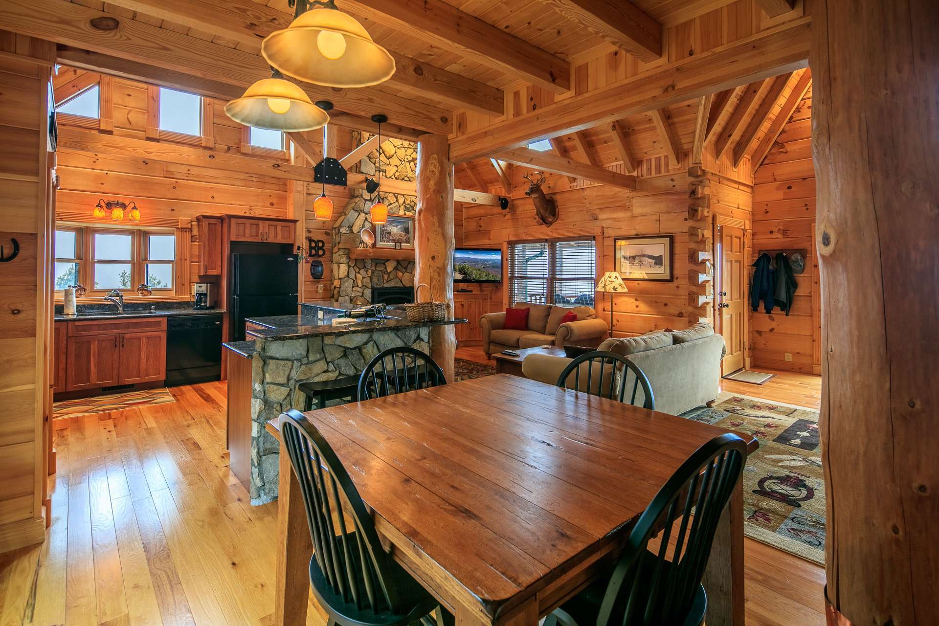 The dining area is placed to enjoy the views and easy access to the back deck.