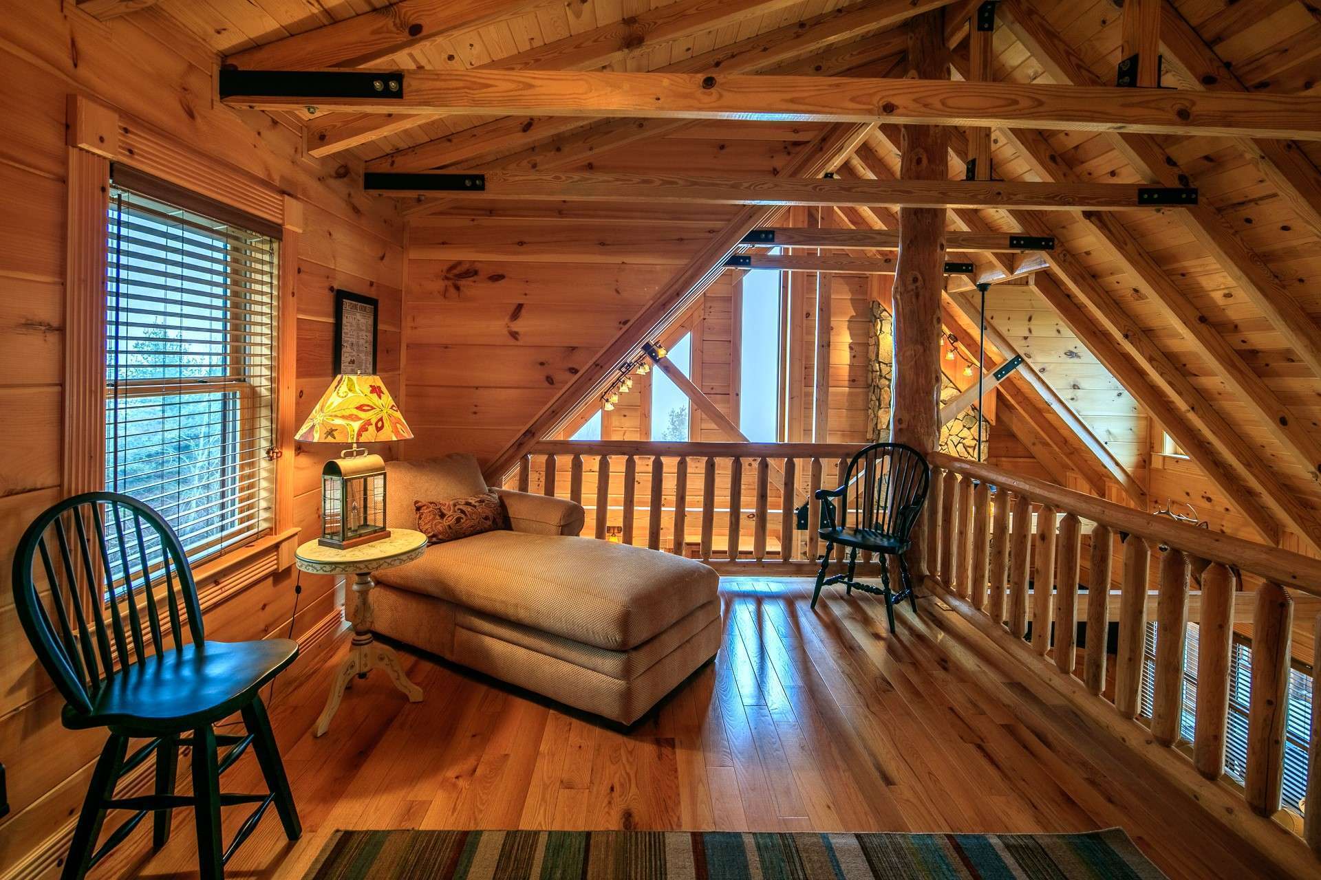 On the upper level you will find this open loft area overlooking the great room.