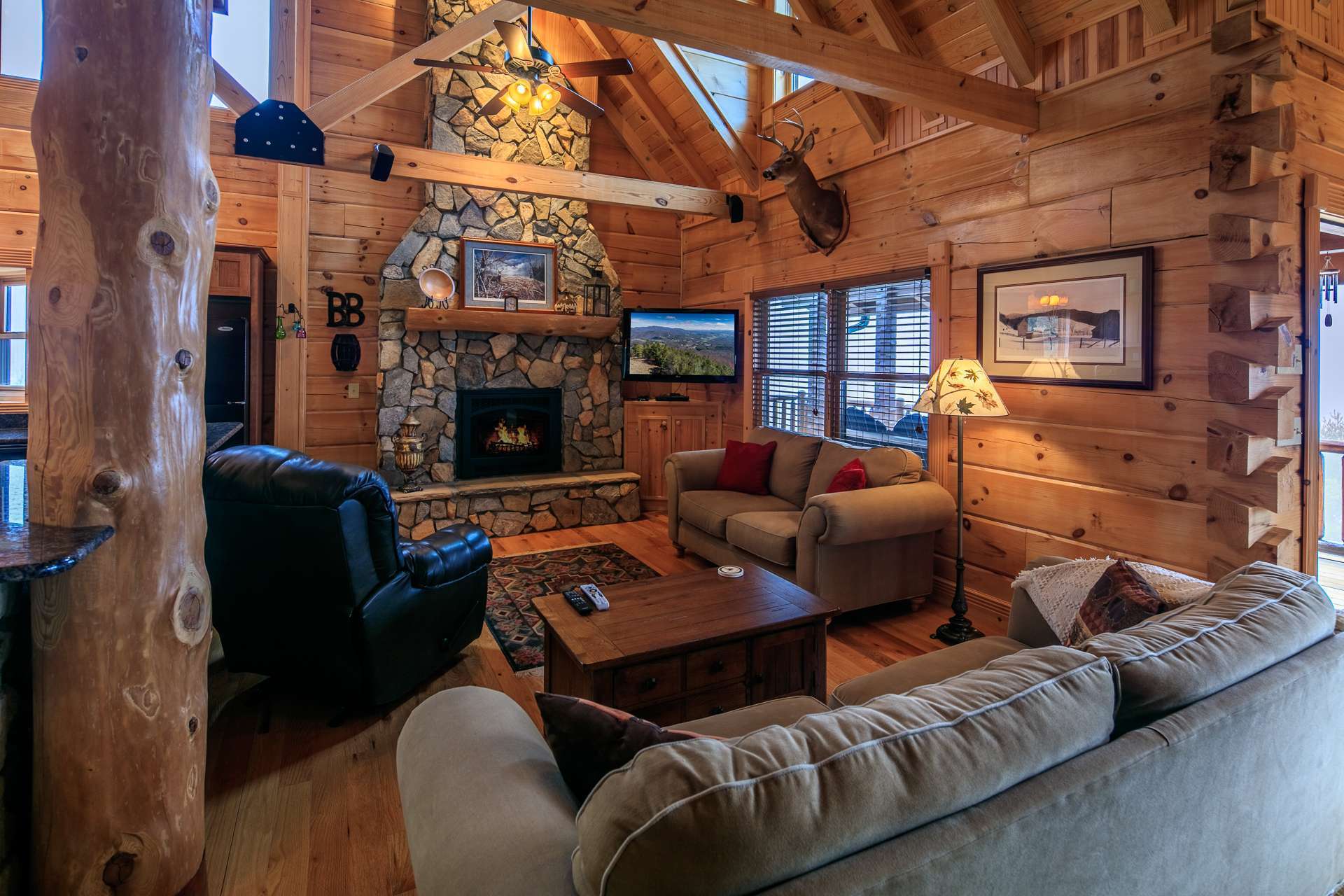 The living area focuses on savoring true mountain living with modern conveniences. You will enjoy the added warmth and ambiance of the two-story stone fireplace.