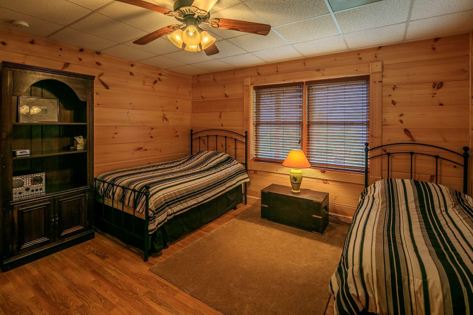 The third bedroom is located on the partially finished walk-out lower level and features a large walk-in closet and a full bath.  This is another private area for your overnight guests.