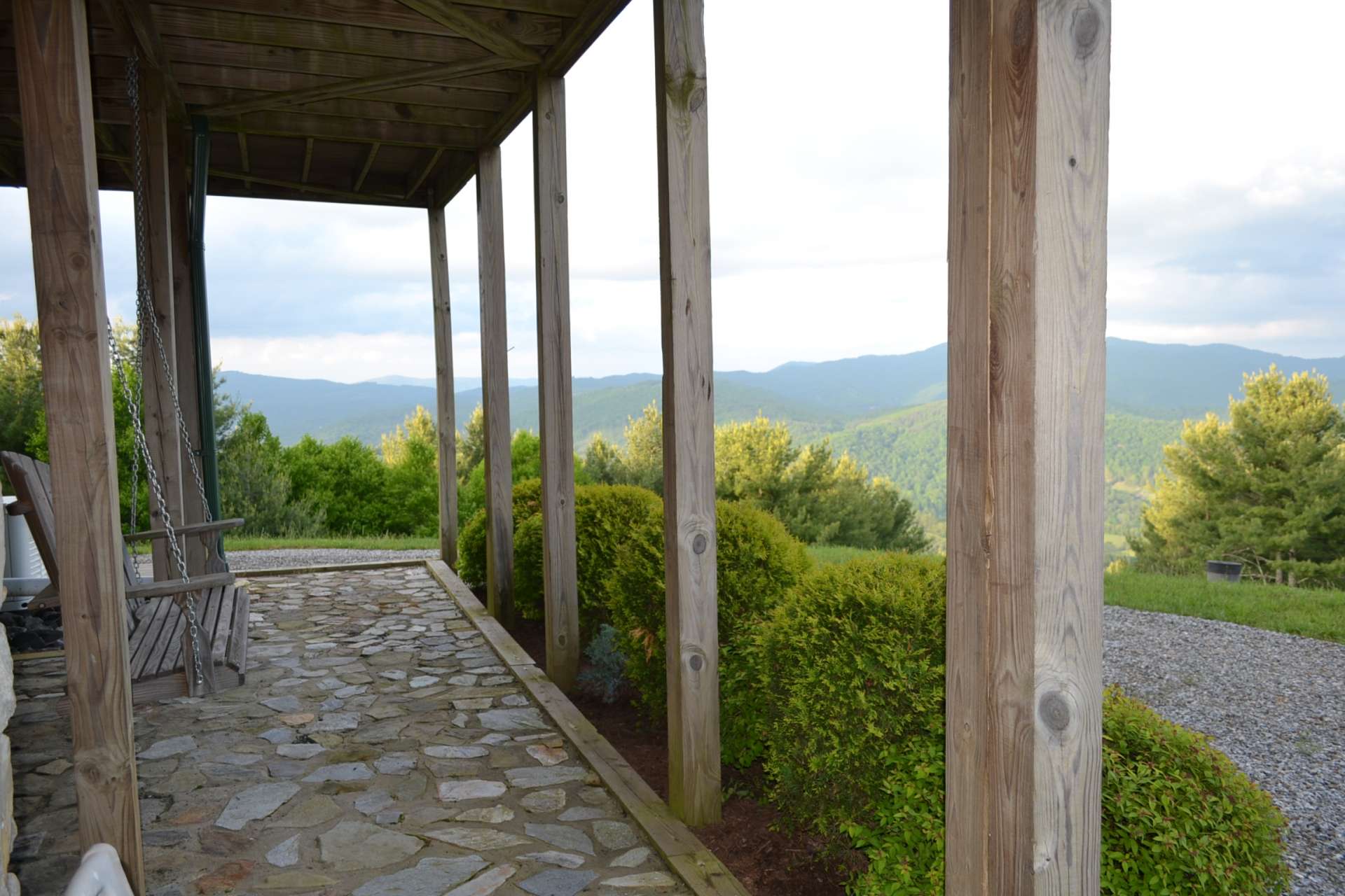 The lower level patio expands the outdoor living area and a great place to enjoy the views.  The setting offers open grasslands with the bulk of the property beautifully wooded offering a mixture of hardwoods, evergreens & mountain foliage, abundant wildlife & spectacular views. Clean fresh mountain air!