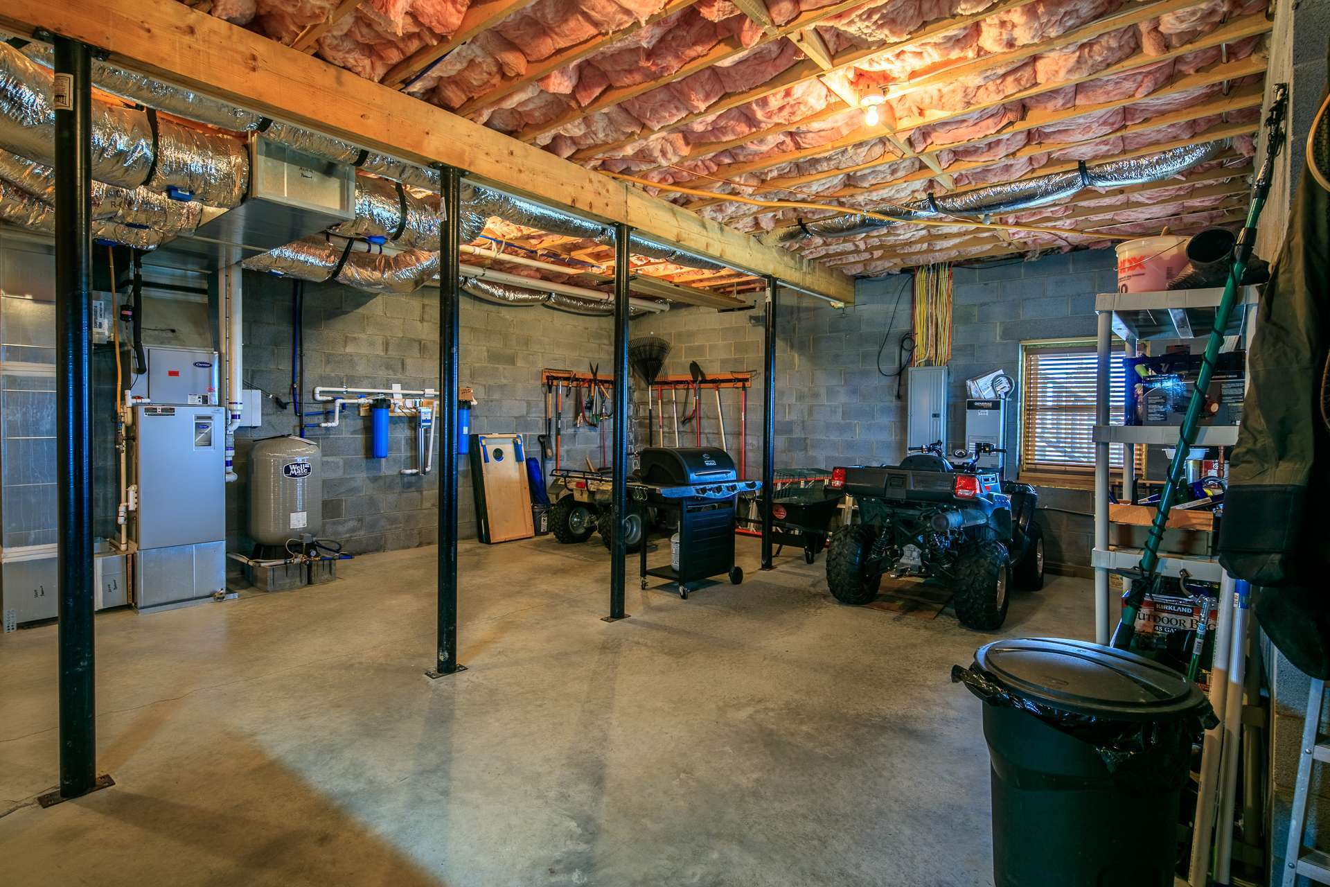 The lower level also offers a spacious workshop and storage area for all of your lawn equipment and mountain toys.  (You walk through this area to reach the  finished area.)