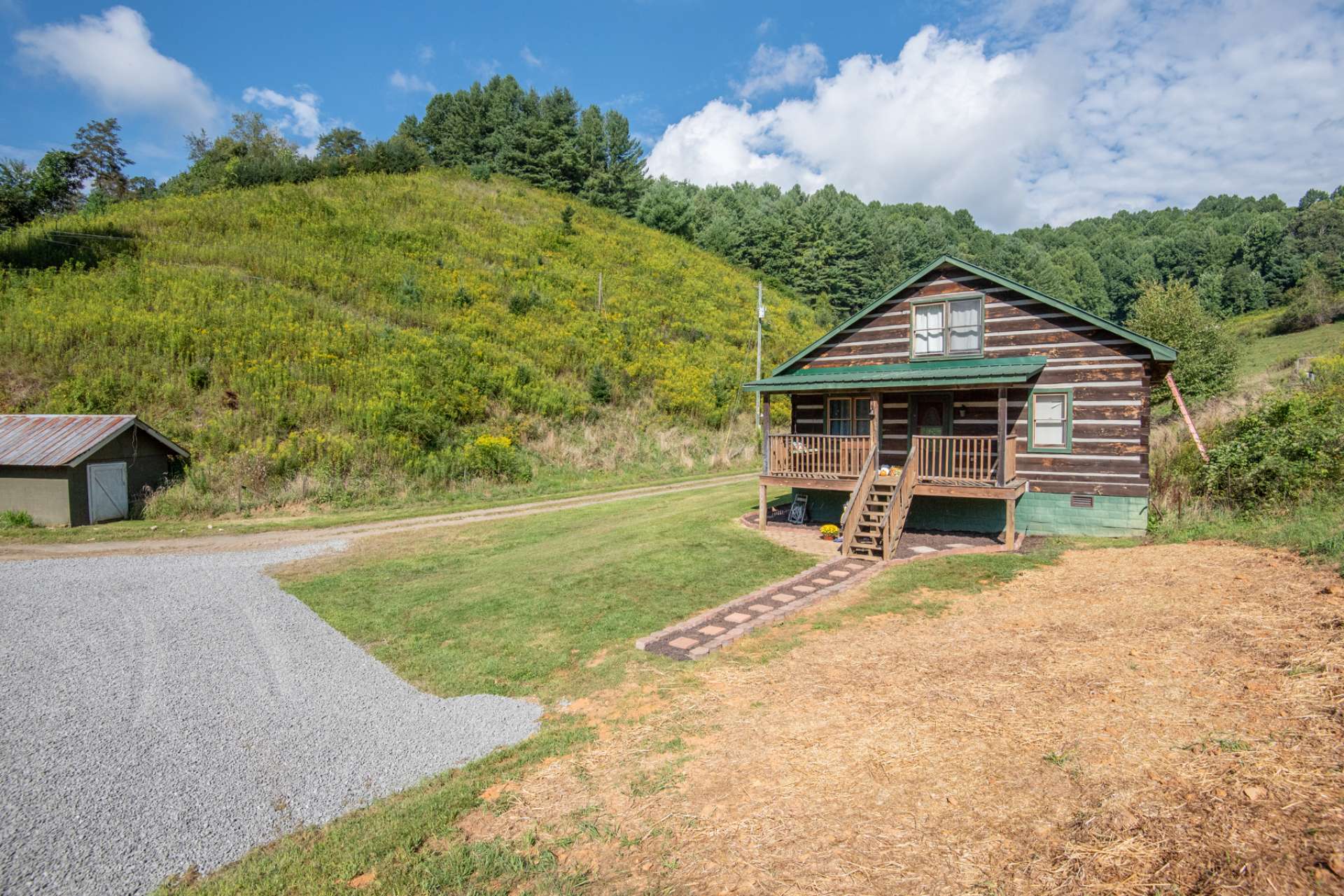 Hill behind the shed is all part of the property