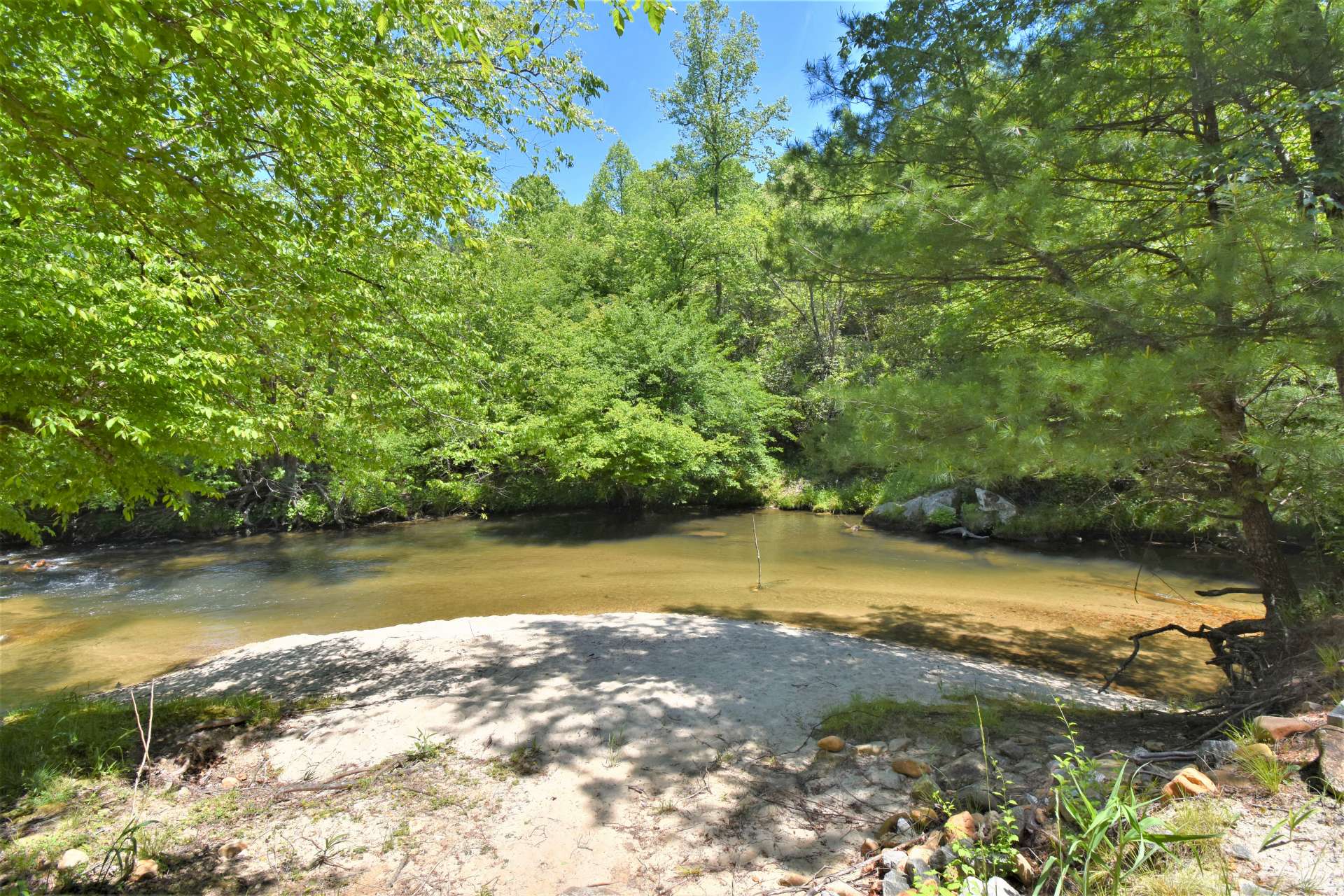 Your own beach!  What a wonderful place to enjoy an afternoon picnic, fishing, or playing in the creek.