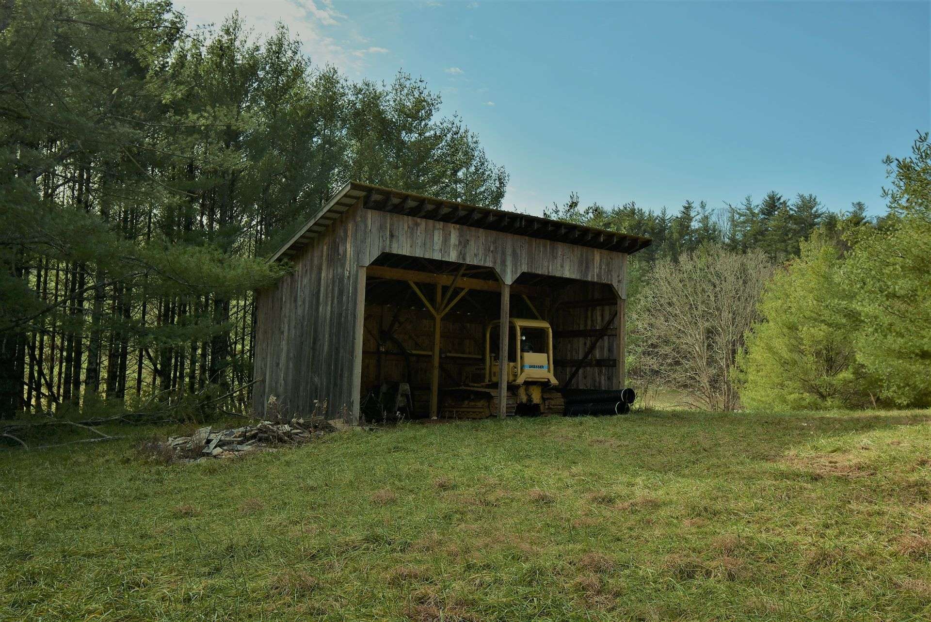 Already in place, this outbuilding will serve nicely for equipment and hay storage, as well as a run in shed for your horse.