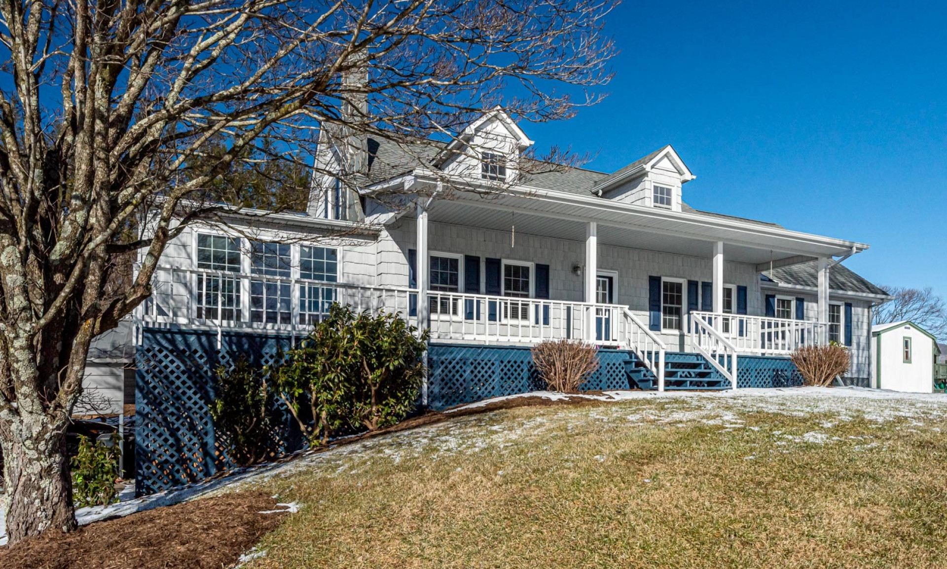 Nestled upon a 1.12 acre setting in a quiet community just minutes from Downtown West Jefferson, this spacious 3-bedroom, plus bonus rooms,  4-bath Cape Cod style home  offers luxury mountain living  close to many NC High Country destinations.