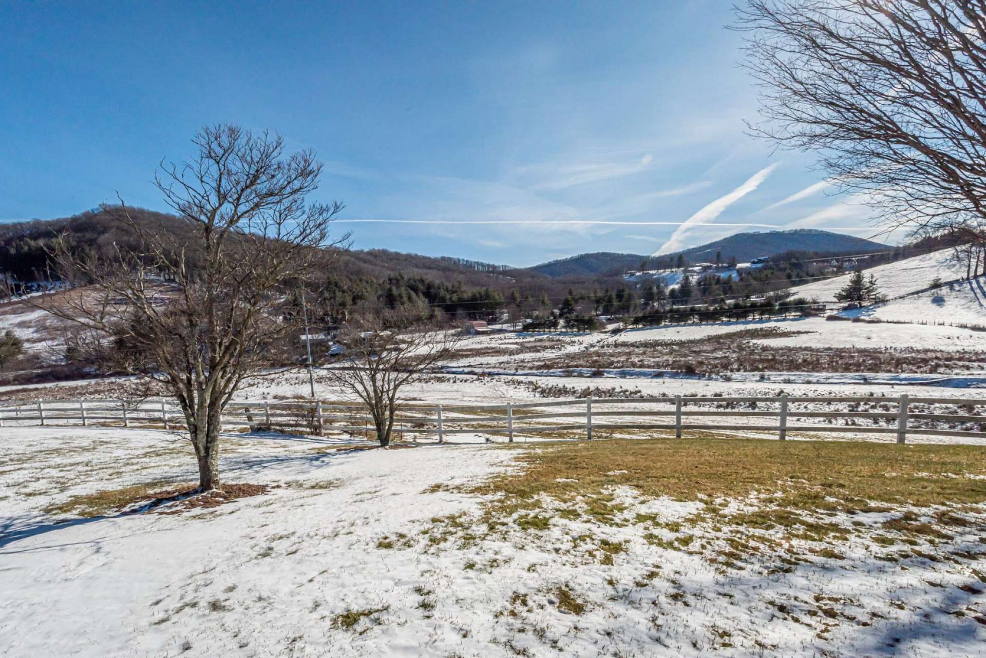 Enjoy a nice fenced yard and serene  mountain views from the  rocking chair covered porch.