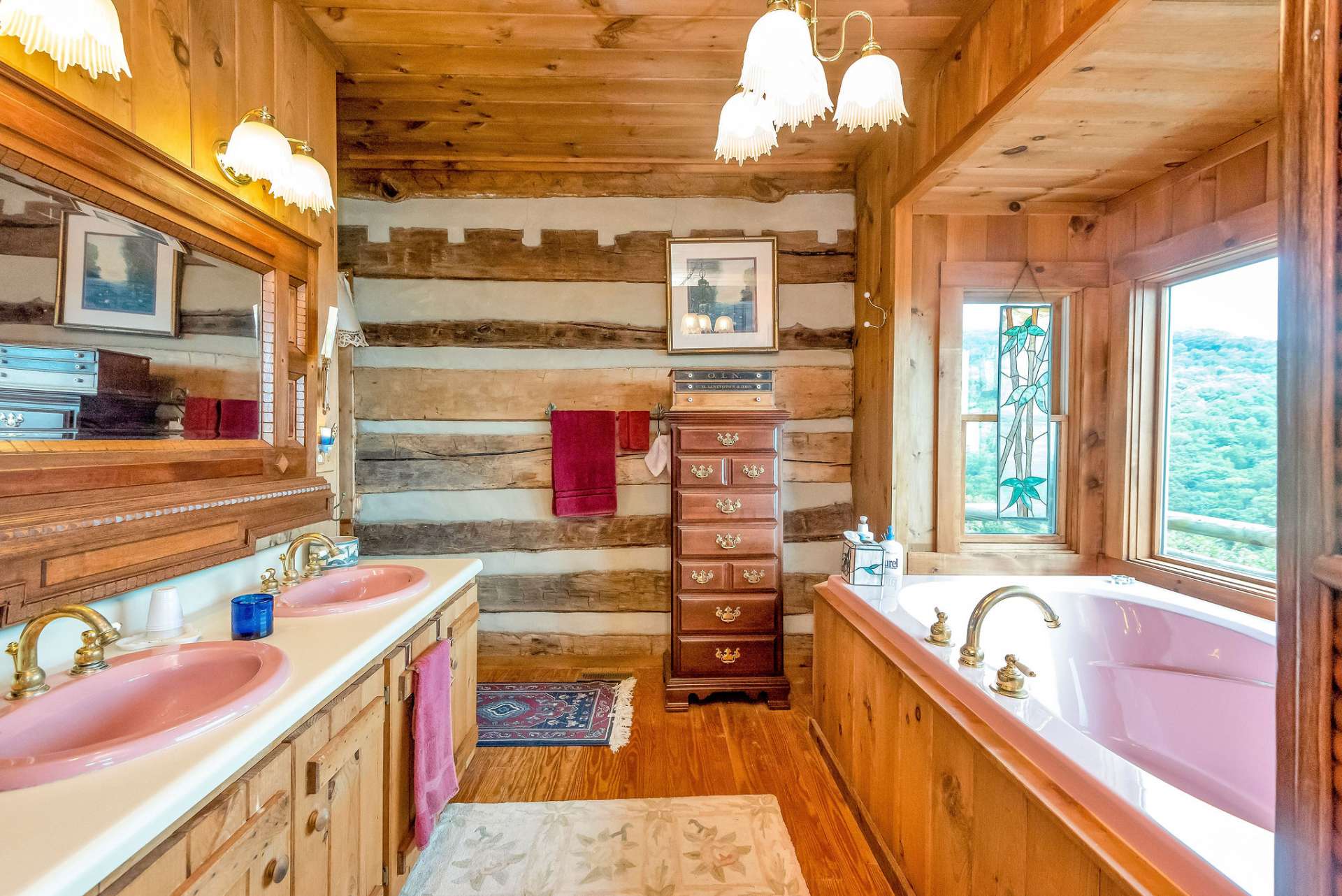 Primary bath offers double sinks with the shower and toilet around the corner.