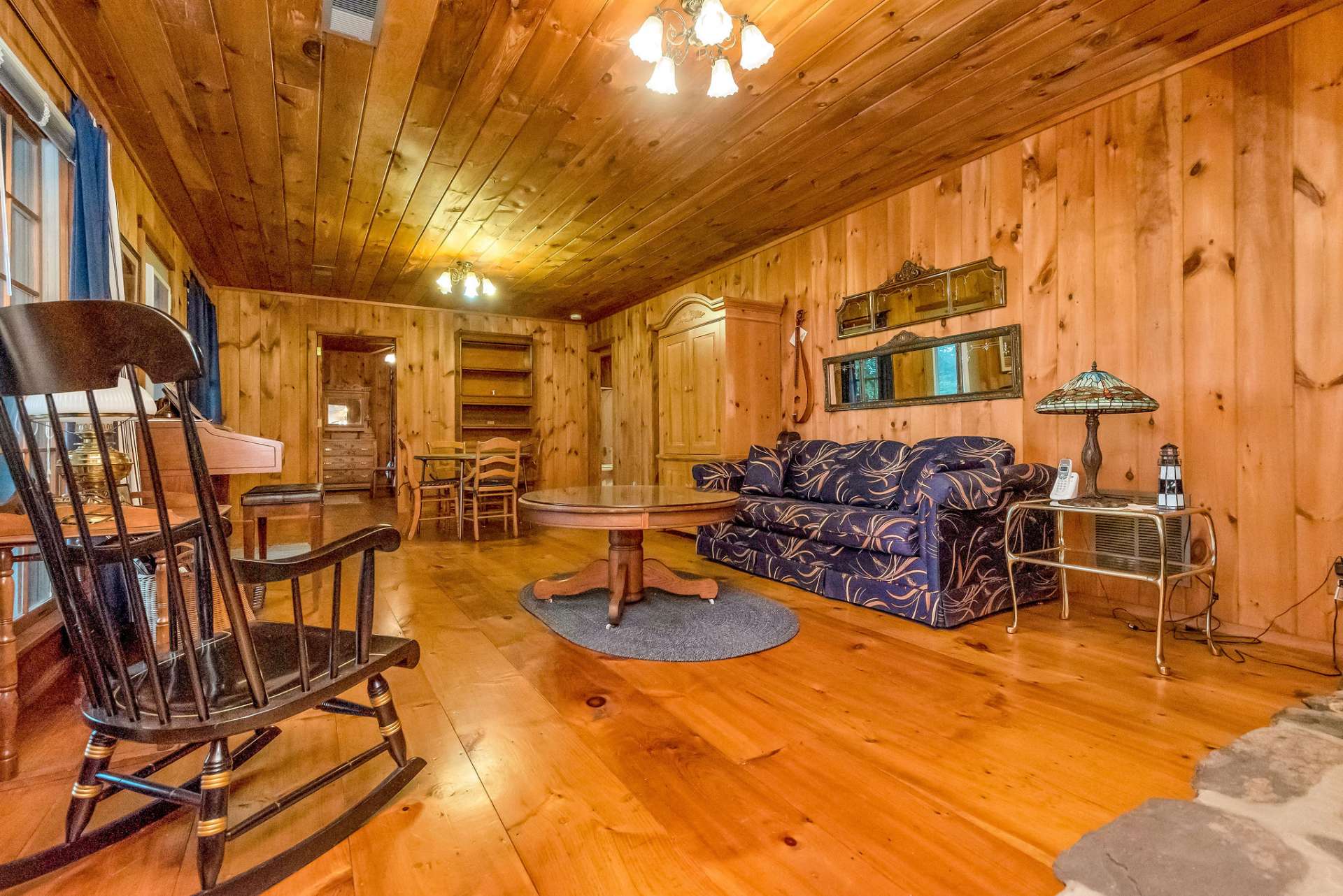 Lower level family room with access to lower deck is ideal for entertaining and game nights.