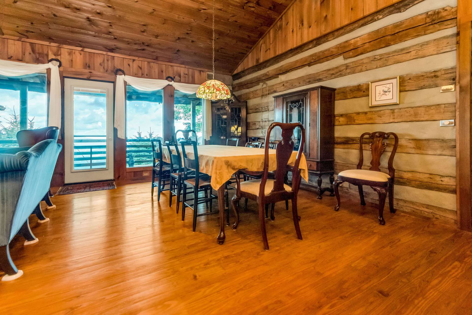 This dining area can host a multitude of guests for holiday entertaining. The door leads to the covered deck for more oohs and aahs.