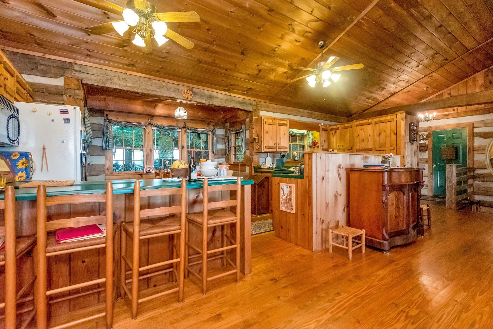 The kitchen offers additional seating or entertaining space with a bar.