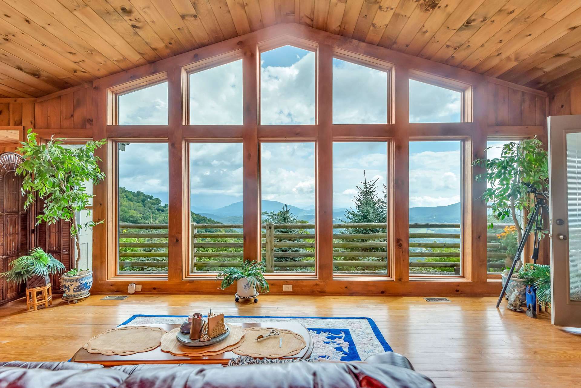 Imagine waking up and seeing the sunrise through this expansive wall of windows every morning!