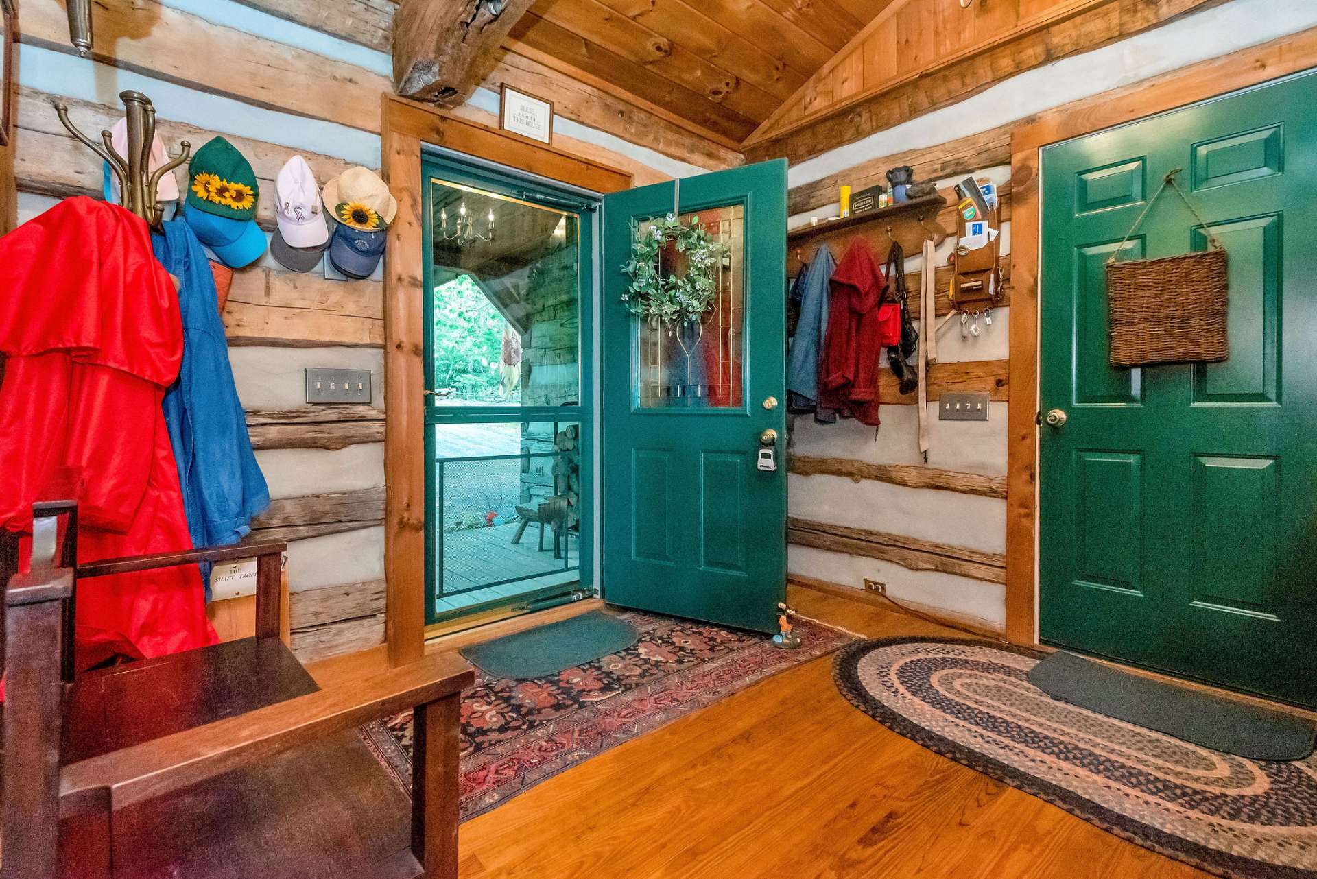 Accessing the cabin from either the covered front porch or garage, you'll have ample space to hang up coats, hats and favorite walking stick!!