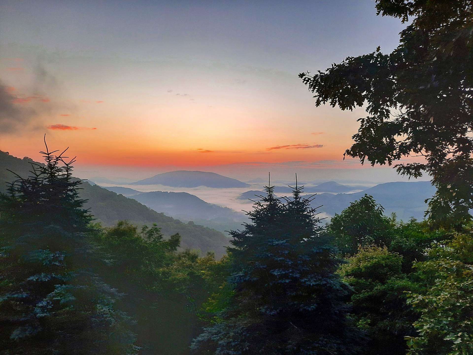 Infinite panoramic views. This photo shot by the homeowner captures the morning clouds settling in the valley below.