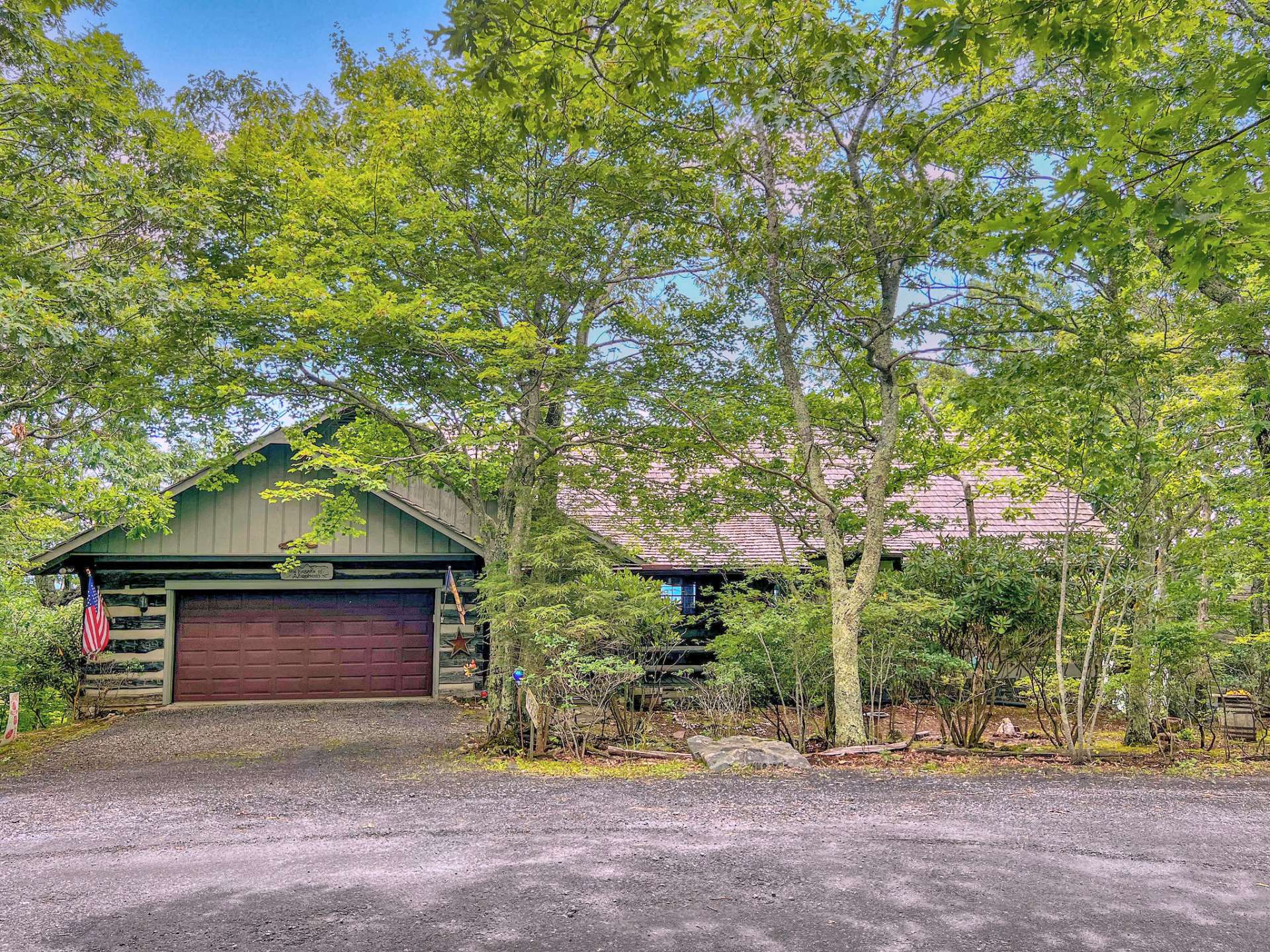 Beautiful log cabin with two car garage set atop the mountain in the timeless community of Stonebridge. Unassuming at first glance - be prepared to be WOWed!!