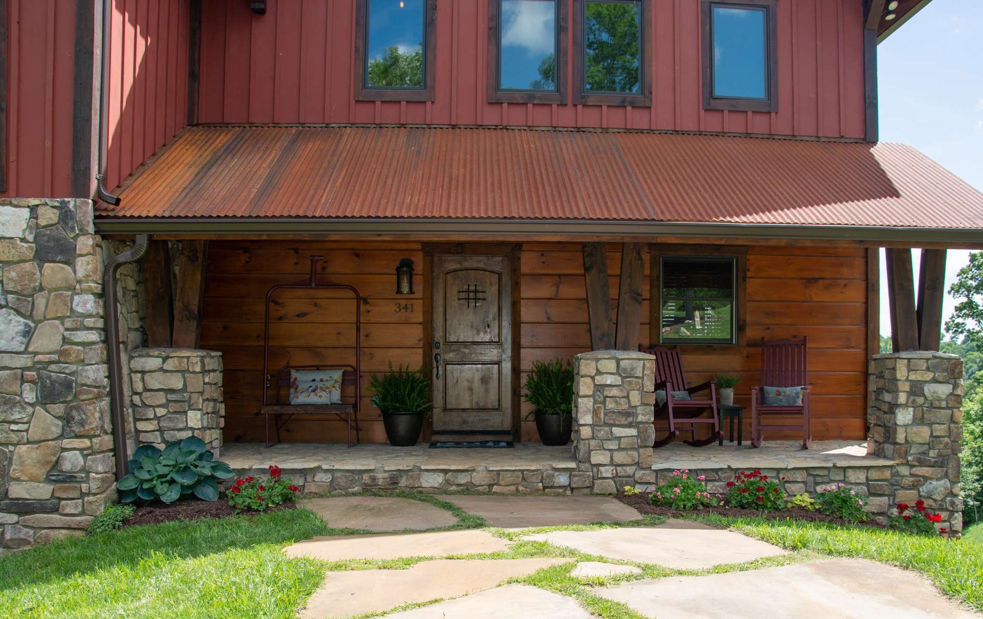 A covered front porch welcomes you to come inside to explore the many custom details and architectural accents that make this mountain home a true treasure.