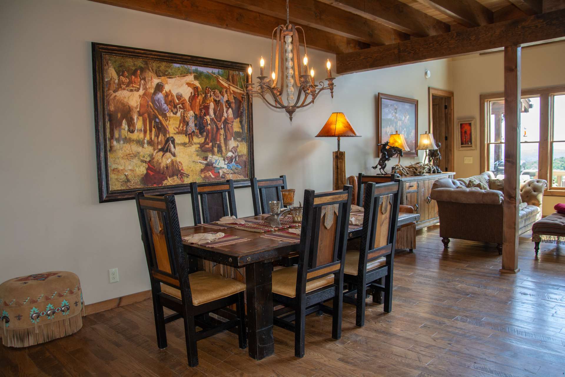 The dining and kitchen is open to the living area creating easy flow when entertaining.  Notice the access to the back deck for outdoor dining.