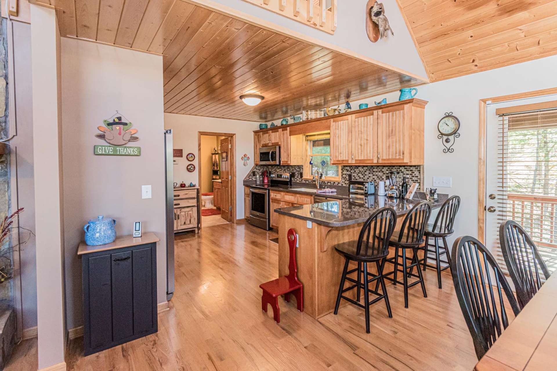 An open floor plan allows for easy transition from the living area to the kitchen and dining areas when entertaining friends and family or just enjoying a quiet evening reading your favorite book or watching TV.