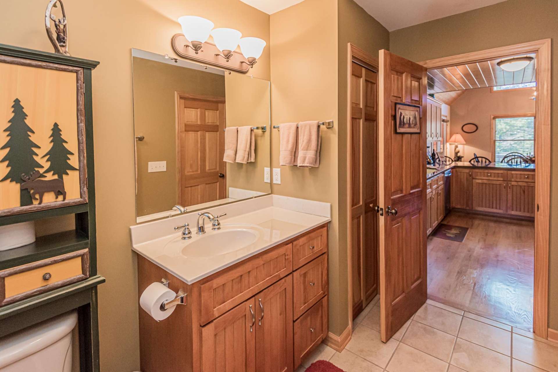 A large full bath with tiled walk-in shower completes the main level.