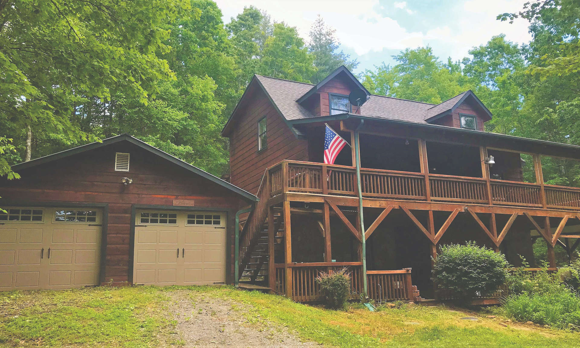LOG CABIN IN THE WOODS!  Enjoy lots of peace and quiet in this 2-bedroom, 3-bath log cabin located on 1.38 acres in the Painted Laurel community.