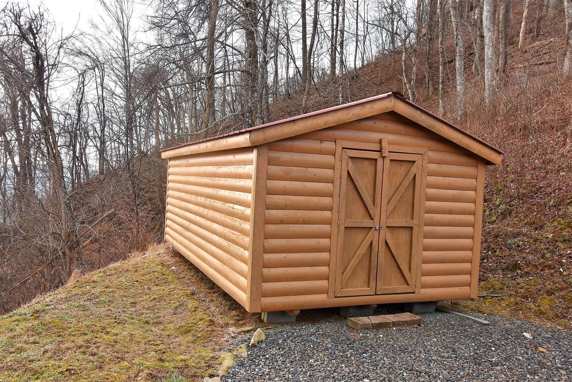 You will find this outbuilding convenient for storing all or your lawn equipment, tools, and mountain toys.