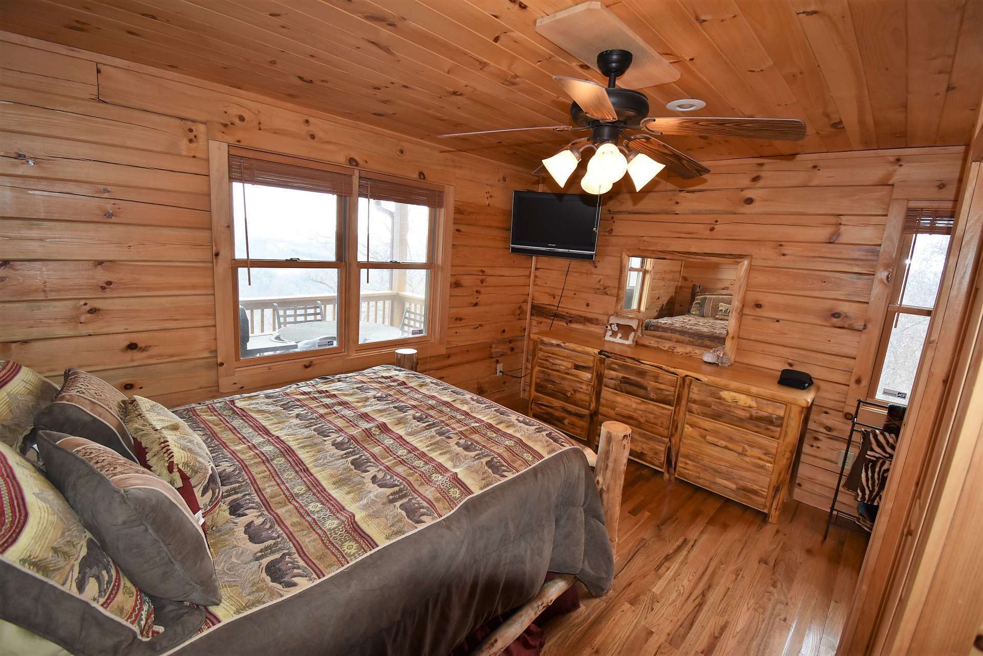 The main level master suite is spacious and features plenty of windows and a private bath.