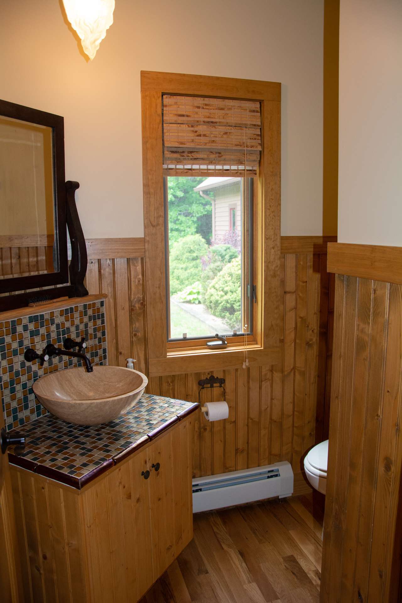 A laundry room, powder room and heated 2-car garage complete the main level.