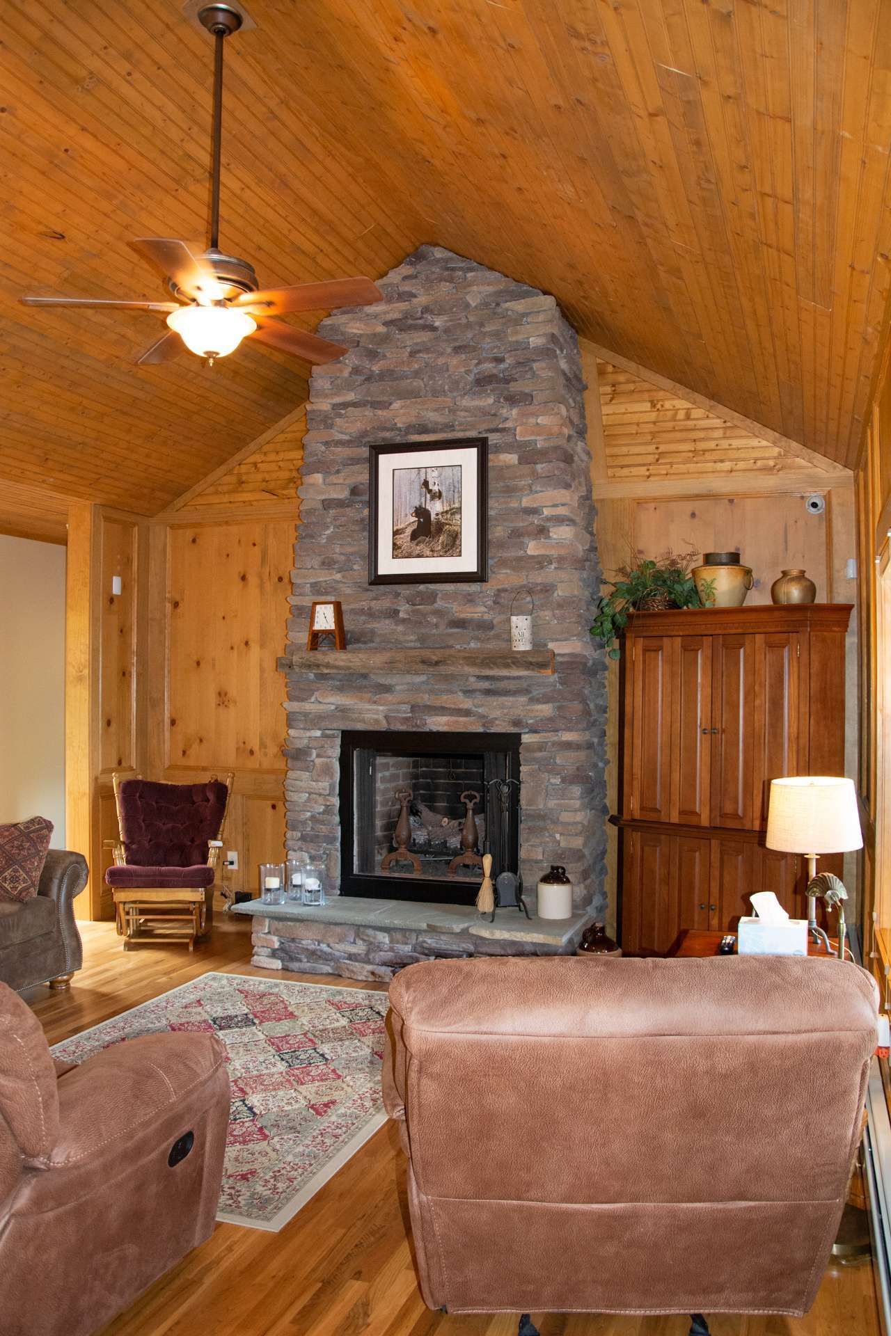 The living room is the ideal place to enjoy a good book with the warmth from the fireplace on winter evenings in the NC Mountains.