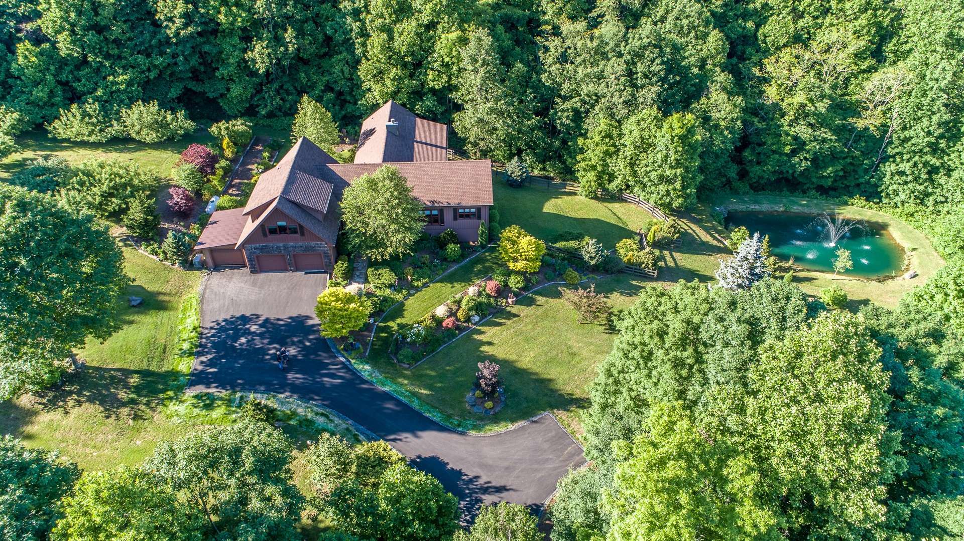 This meticulously kept estate boasts exceptional design with lavish finishes, rustic and elegant architectural details, and impeccable customized features throughout the residence.