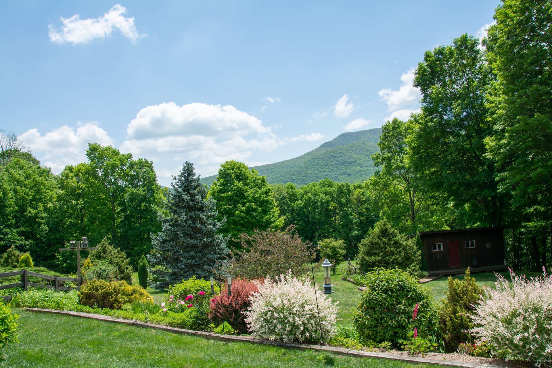This lovingly landscaped 8+ acre estate offers a relaxed and peaceful life style oriented toward gracious mountain living.